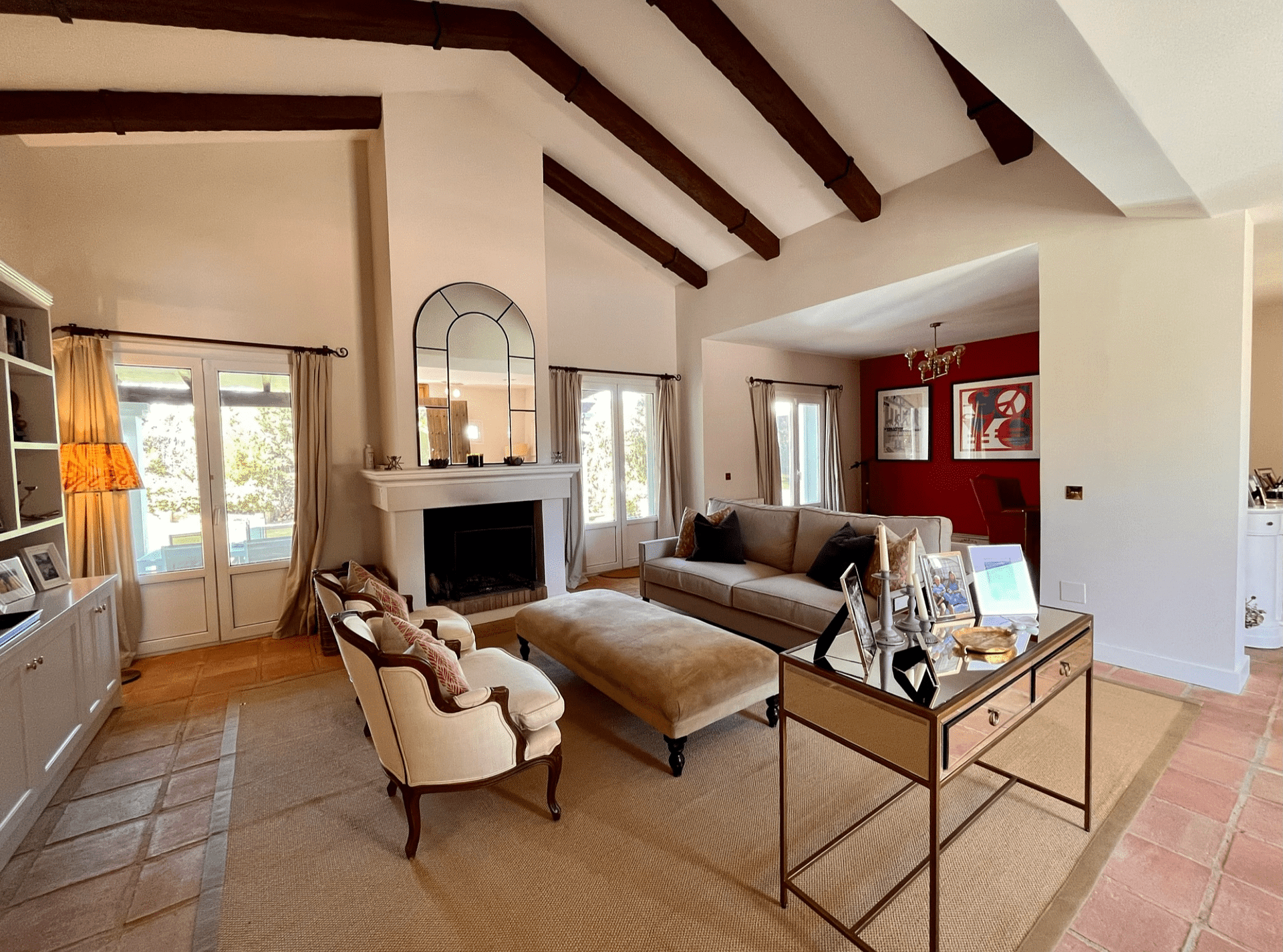 Sunny day view of a beautiful villa and its meticulously landscaped garden in Sotogrande Real estate.
